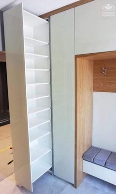 a room with some shelves and a bench in it