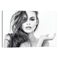 a black and white photo of a woman with her hair blowing in the wind canvas wall art print