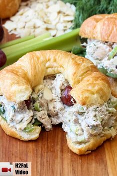 a croissant filled with chicken salad and grapes