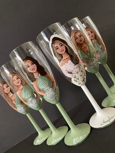 four wine glasses with bridesmaids painted on the bottom one is green and the other is white