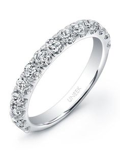 a white gold wedding band with rows of diamonds