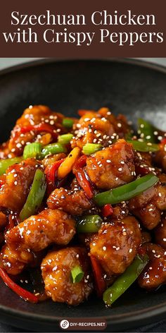 chicken with crispy peppers on a black plate