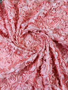 the fabric is pink and white with flowers on it's side, as well as an image of a rose