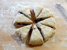 a cut up cookie sitting on top of a wooden cutting board