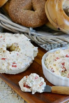 some bagels and dip are sitting on a table