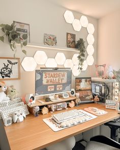 a computer desk with various items on it