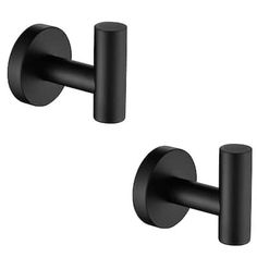 two black wall mounted toilet paper holders on a white background, one is closed and the other is closed