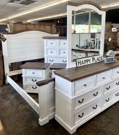 a large white dresser sitting inside of a store