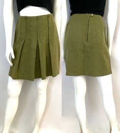 "Vintage 60's Sears Jr's Bazaar, Green Pleated, Mini Skirt (Size 6) This 60's Skirt comes in a pea green wool and is unlined, and is a flare shape with pleats, and has a back zipper closure and sits well above the knee in length. *The skirt is unlined. *Label varified by the vintage fashion guild. 100% Wool Made in USA *This skirt is in excellent condition. *This skirt ships Priority Mail within the US Only. Size: (M) Modern Day 6 (Tag Size: 11) Waist: 26\" Hips: 36\" Length: 17 1/2\" Weight: 14 oz *Follow FreshandSwanky on Instagram" Retro Fitted Short Skirt, Retro High Waist Fitted Skort, Retro High-waist Fitted Skort, Retro Pleated Short Skirt, Retro Short Pleated Skirt, Retro Pleated Skort Of Short Length, Retro Pleated Skort, Retro Pleated Short Skort, Retro Green Pleated Skirt