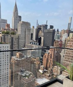 a balcony with cityscape and skyscrapers in the backgroung area