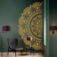 a room with two chairs and a wall decorated with an intricately designed sunflower design