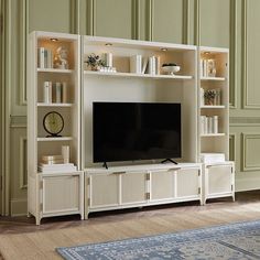 an entertainment center with bookshelves and a large television on it's stand