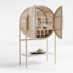 a white table topped with a wooden shelf filled with items