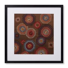 an art work with circles and squares in brown, blue, red and orange colors