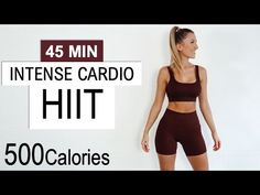 a woman standing in front of a white wall with the words intense cardio hit