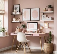 a home office with pink walls and wooden desks, potted plants and pictures on the wall