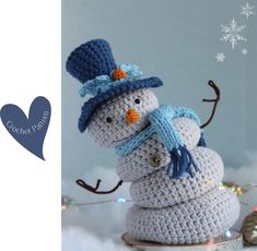 there is a crocheted snowman with a hat on it