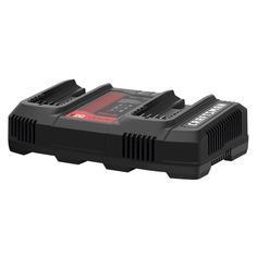 an image of a battery charger with two batteries on the front and one in the back