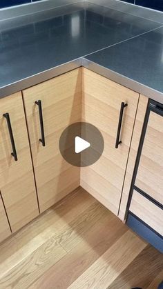 a kitchen with wooden cabinets and stainless steel counter tops is shown in this video showing how to install an appliance