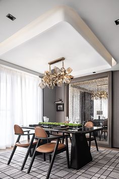 a dining room table with chairs and a chandelier hanging from it's ceiling