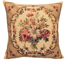 an embroidered pillow with flowers on it