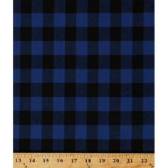 a blue and black plaid fabric with a ruler in front of the image, it is very