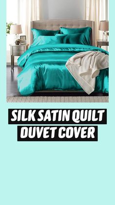 a bed with teal colored sheets and pillows