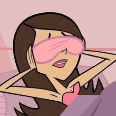 a woman with pink eye patches on her face and hand covering her eyes while laying in bed