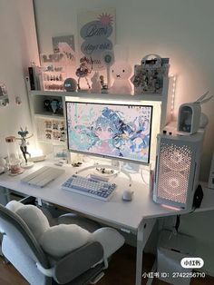 a white desk topped with a computer monitor and keyboard