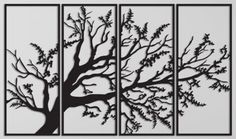 three black and white paintings with trees on them