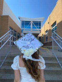 a woman wearing a graduation cap with flowers on it