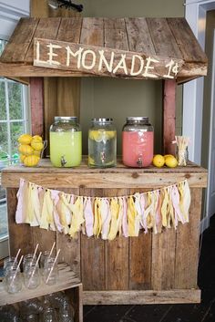 a lemonade stand is decorated with mason jars