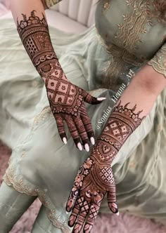 a woman with henna on her hands