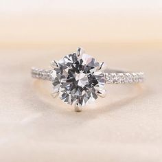 an engagement ring with a round brilliant cut diamond