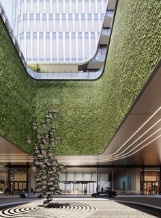 the interior of a building with grass growing on it