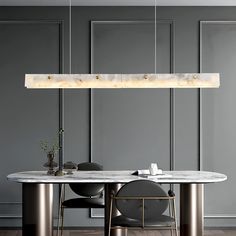 an image of a dining room setting with marble table and chairs in the center, along with modern lighting fixtures