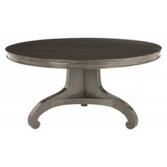 an oval dining table with metal legs