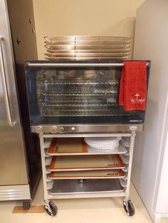 an oven sitting next to a refrigerator in a kitchen