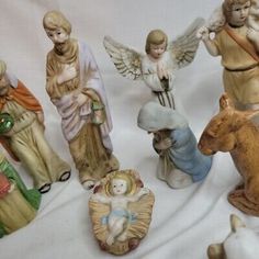 seven figurines of different sizes and shapes