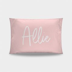 a pink pillow with the word'aleie'written on it in white ink