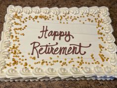 a white cake with gold sprinkles and the words happy retirement written on it