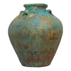 an old, rusted green vase with holes in the bottom is shown on a white background