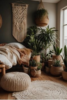 Bohemian-themed bedroom with numerous houseplants, macramé wall decor, and cozy textiles. Rattan Bed Frame, Cozy Bedroom Design, Warm Bedroom, Floral Bedding Sets, Boho Style Bedroom