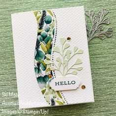 a close up of a greeting card with leaves and words on the front, which reads hello