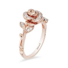 a rose ring with diamonds on it