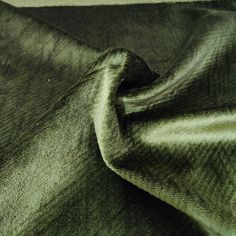 a close up view of a green fabric