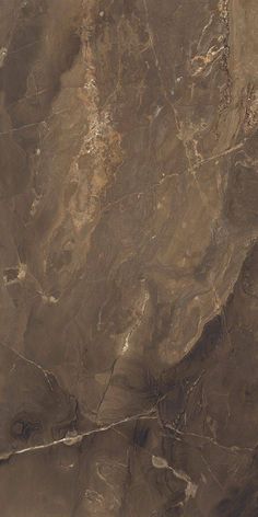 an aerial view of the desert with brown and white rocks on it's sides