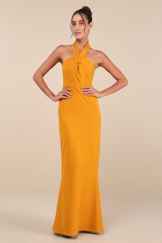 Glide into your next event with ultimate confidence thanks to the Lulus Mesmerizing Perfection Yellow Halter Neck Backless Maxi Dress! This head-turning dress has a woven crepe fabrication that shapes a halter neckline created by wide straps, atop a fitted bodice with seam detailing. High, fitted waist tops a figure-skimming mermaid skirt that falls to a maxi hem with a kick pleat at the back for movement. Turn around to reveal a sexy open-back design that secures with top button-loop closures. Black Tie Dress Code, Head Turning Dress, Dress Halter Neck, Vibrant Dress, Yellow Maxi Dress, Halter Neck Maxi Dress, Backless Maxi Dress, Yellow Maxi, Cocktail Dress Wedding