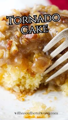 a close up of a piece of cake on a plate with a fork in it