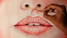 a painting of a woman's lips being painted